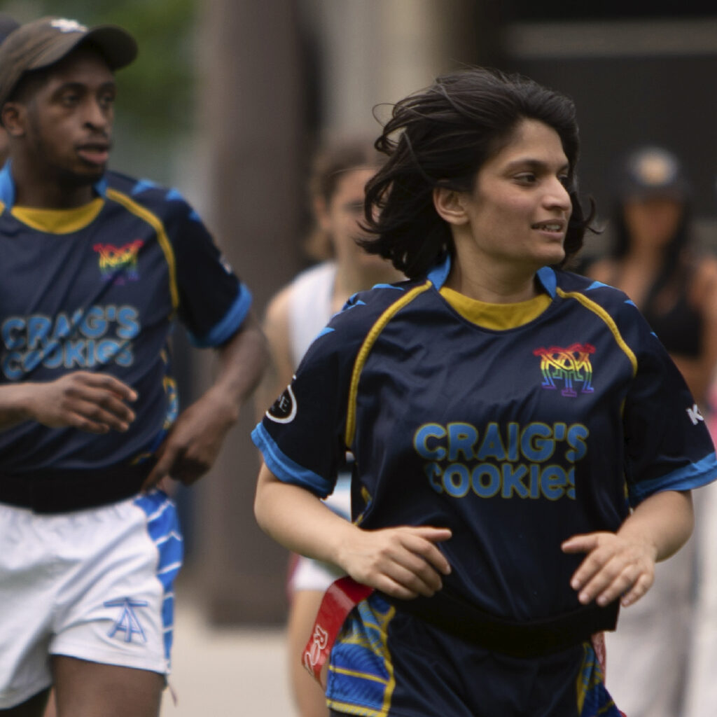 Member of the Muddy York Women's team playing flag rugby at Rugby in the Square.